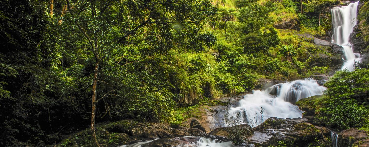 Captivating Sangti Waterfall cascading through lush greenery in Arunachal Pradesh
