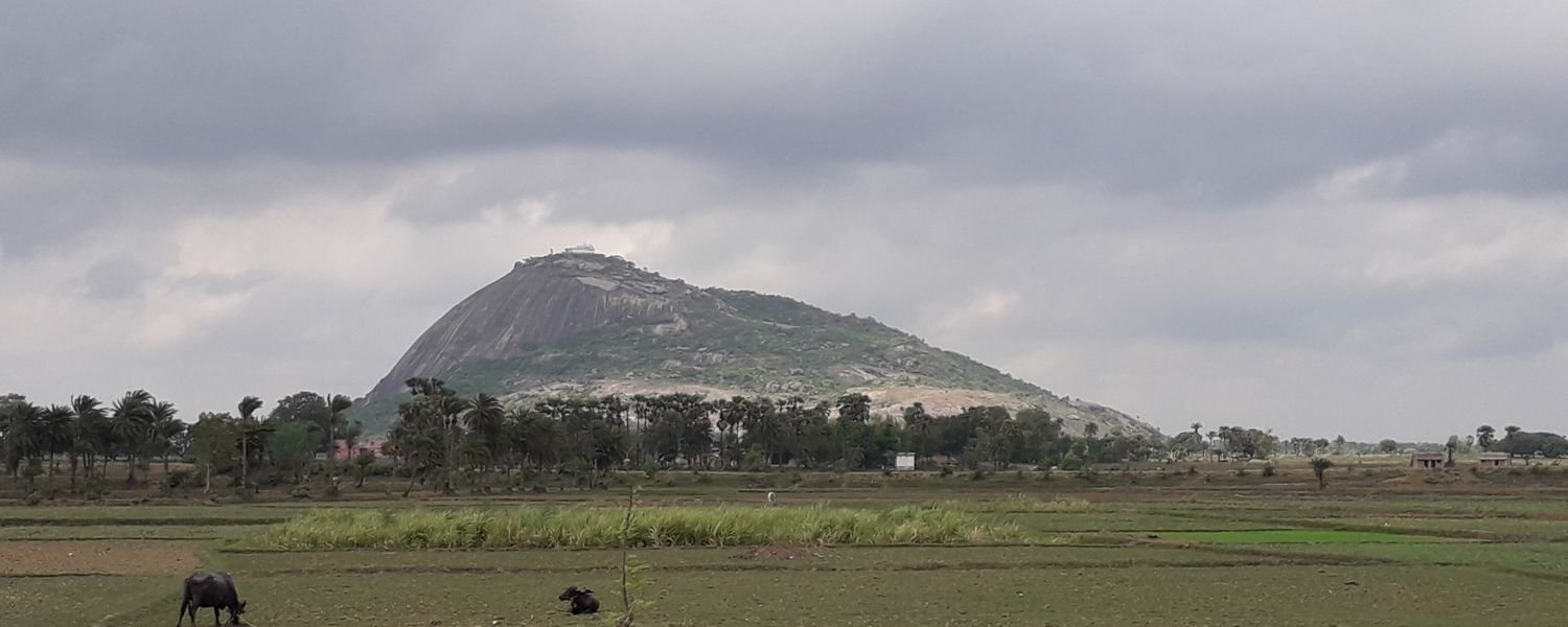 Majestic Mount Mandar (Mandar Parvat) rising above the clouds, a picturesque marvel of nature's grandeur